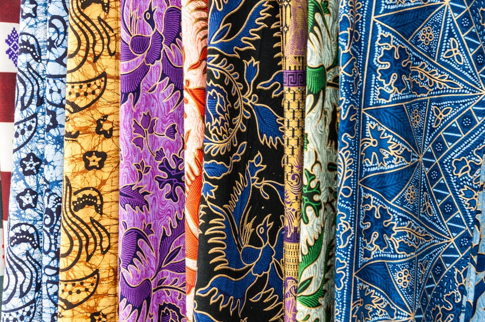Display of colourful batik fabrics.
