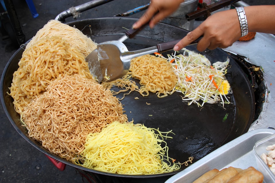Noodles being prepared at a Hawker's market in Singapore on a last minute summer trip