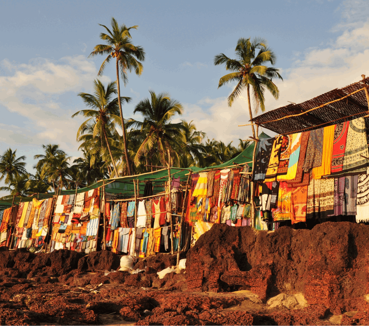 A picture of some colourful beach stalls on Anjuna Beach 