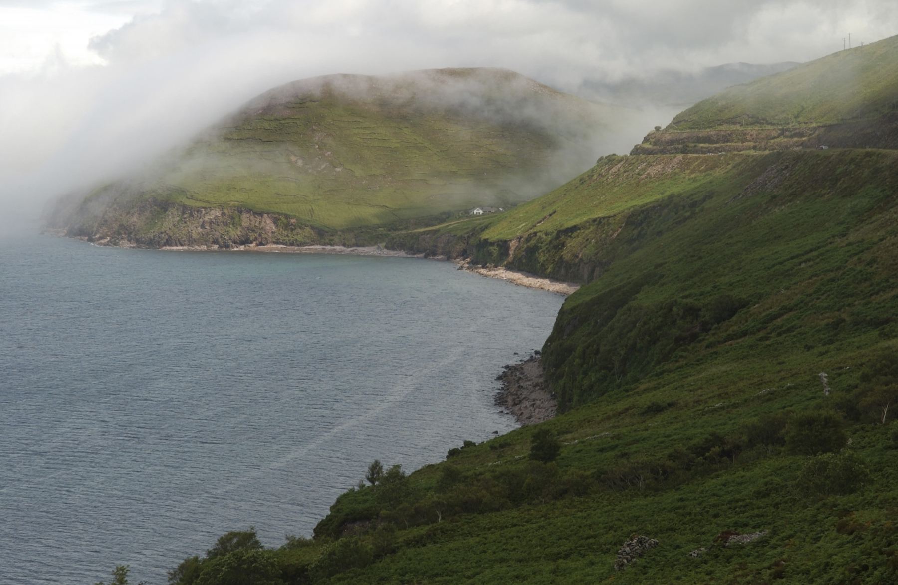 misty cliffside in Ireland by day