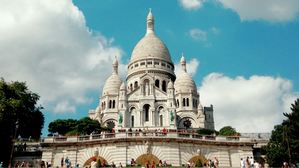 Montmartre, in Paris during the day surrounded by tourists