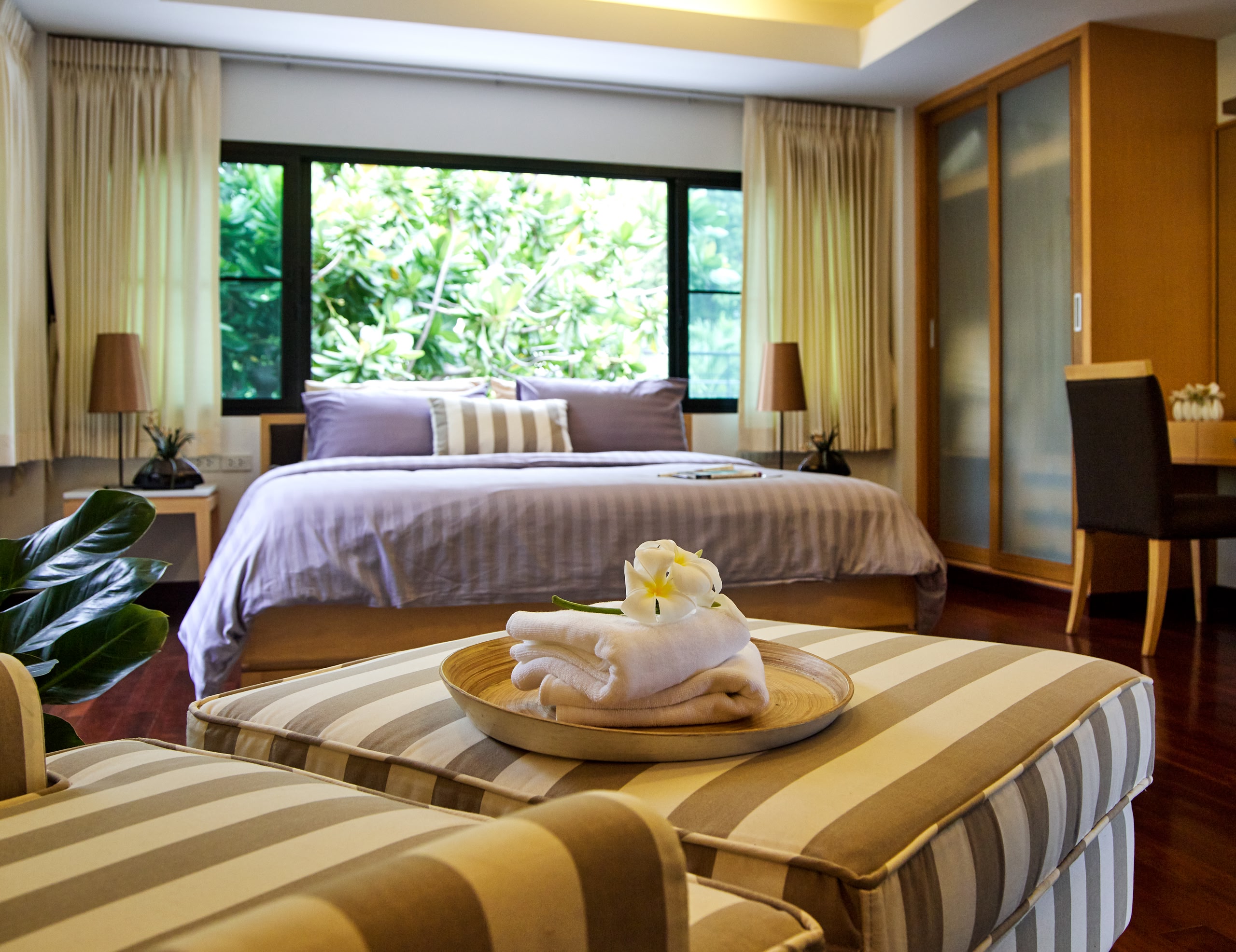 Master bedroom interior in luxury home vintage style. The morning light.