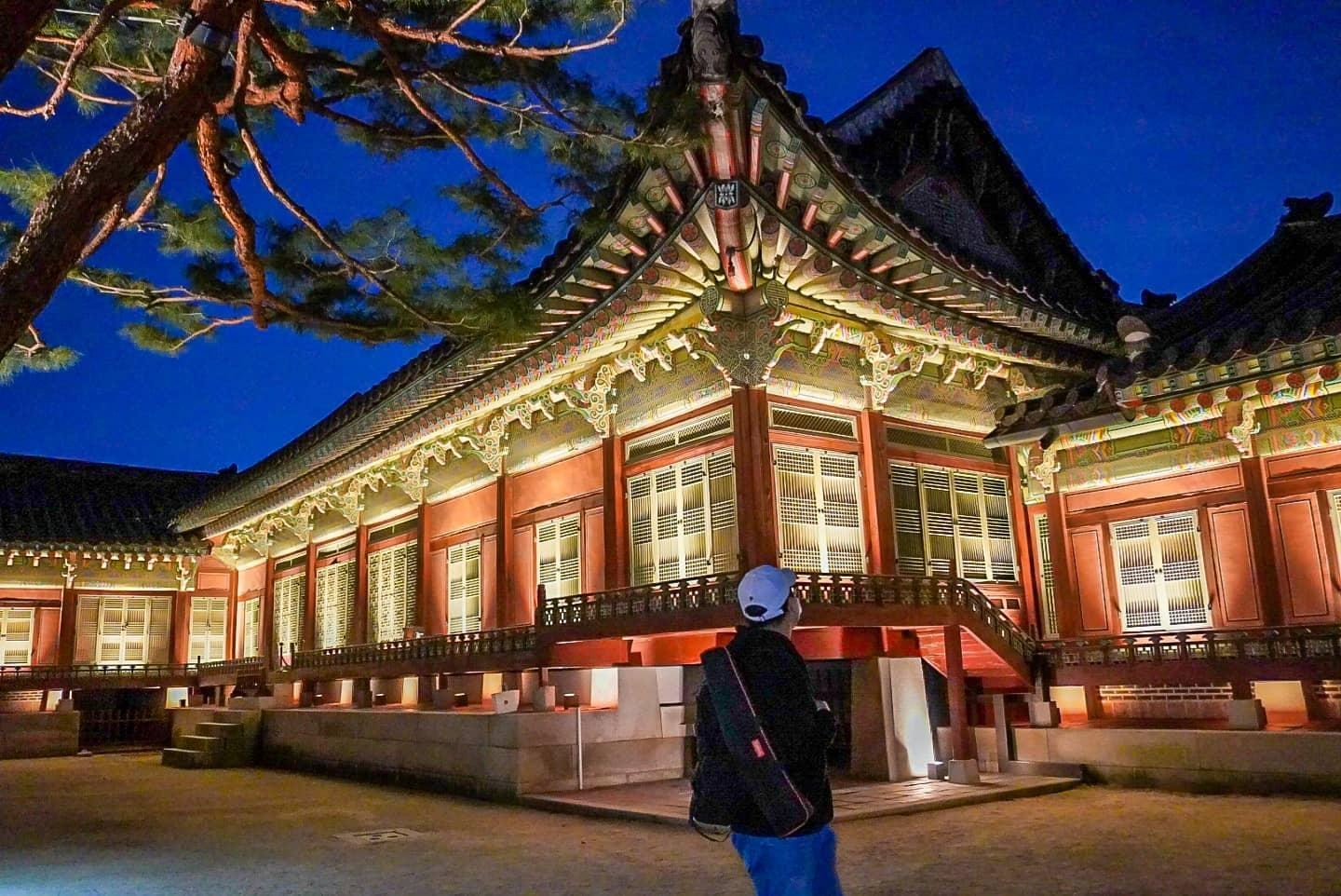solo travellers at a temple at night in Seoul, Korea.