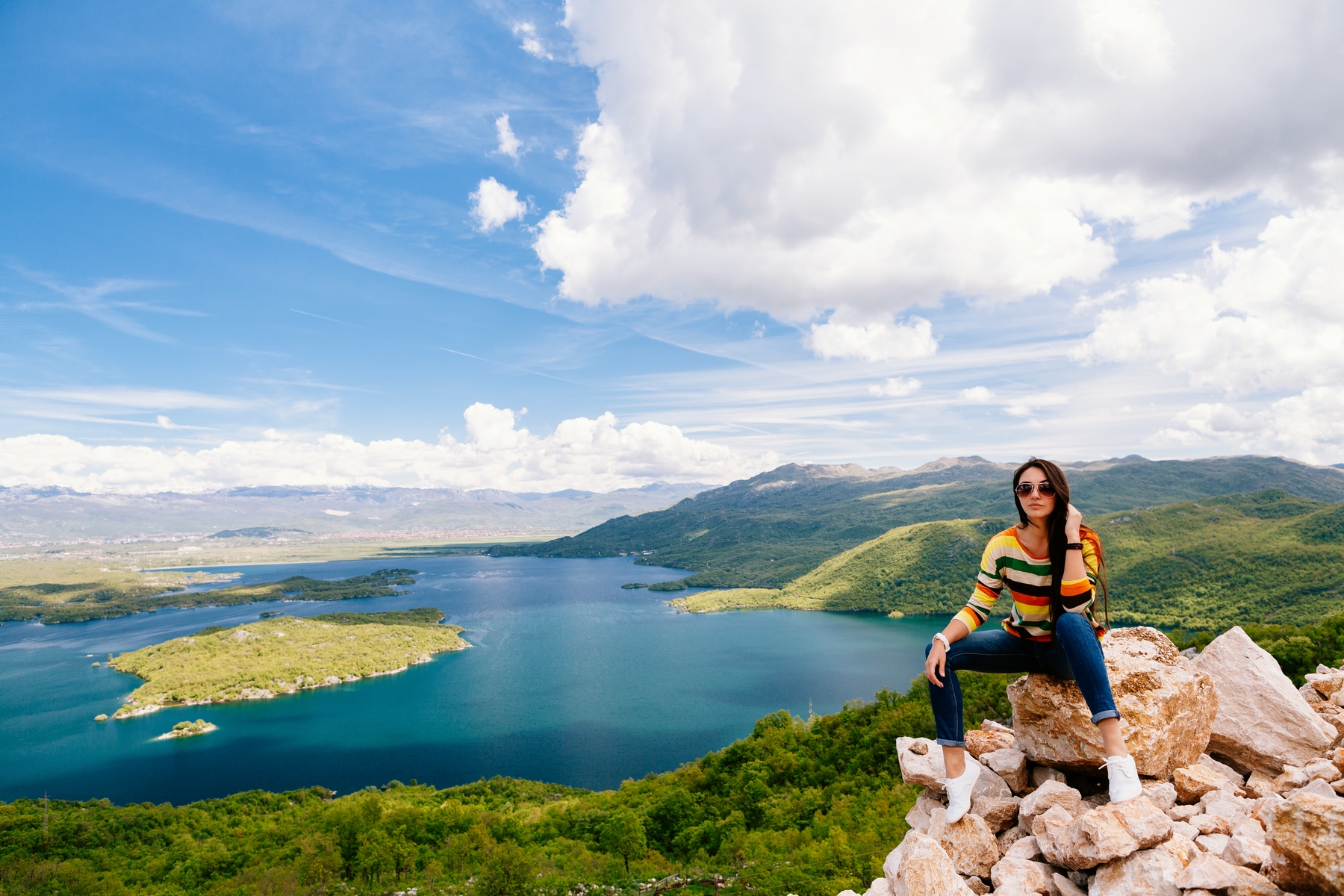 joyful woman travel mountains. Travelling Europe with picturesque view. Montenegro.