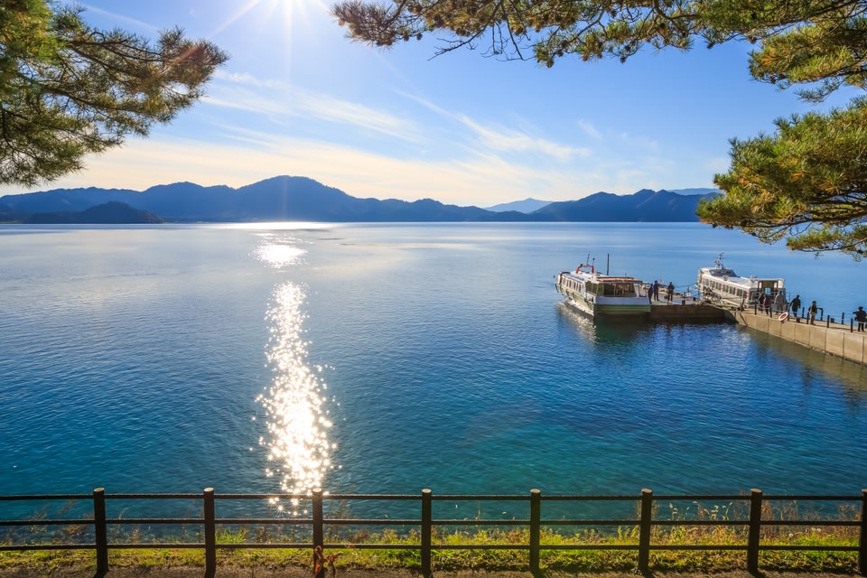 Passenger ships with sparkling sunshine in Lake Tazawa - Senboku, Akita, Japan