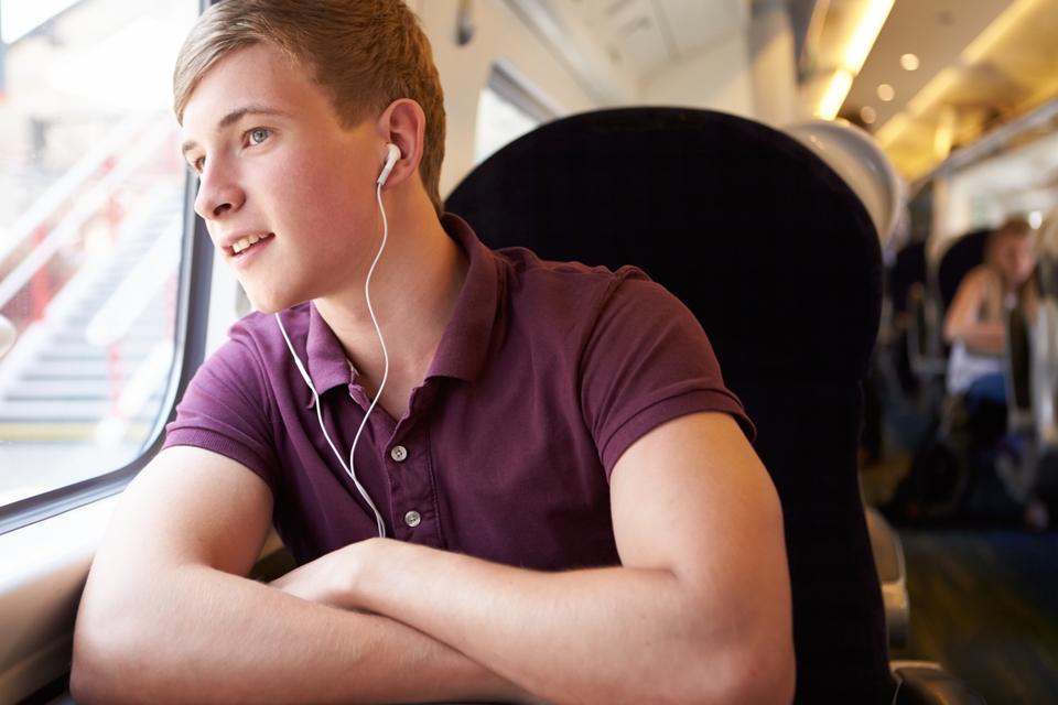Solo male traveller on a train