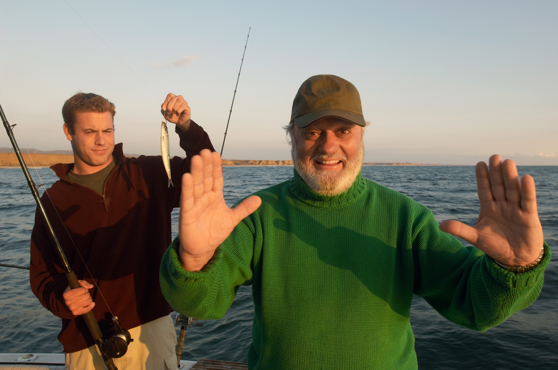 two men fishing at a lake