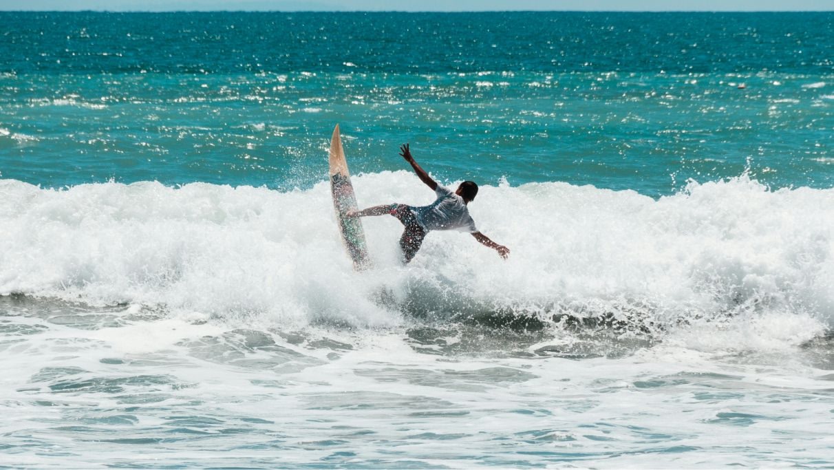 Person surfing on a blue sea during daytime, 