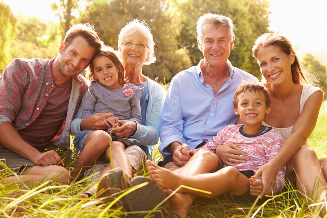 Family with kids and grandparents in the countryside