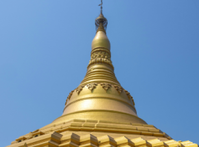 detail of a large golden building in Delhi during daytime
