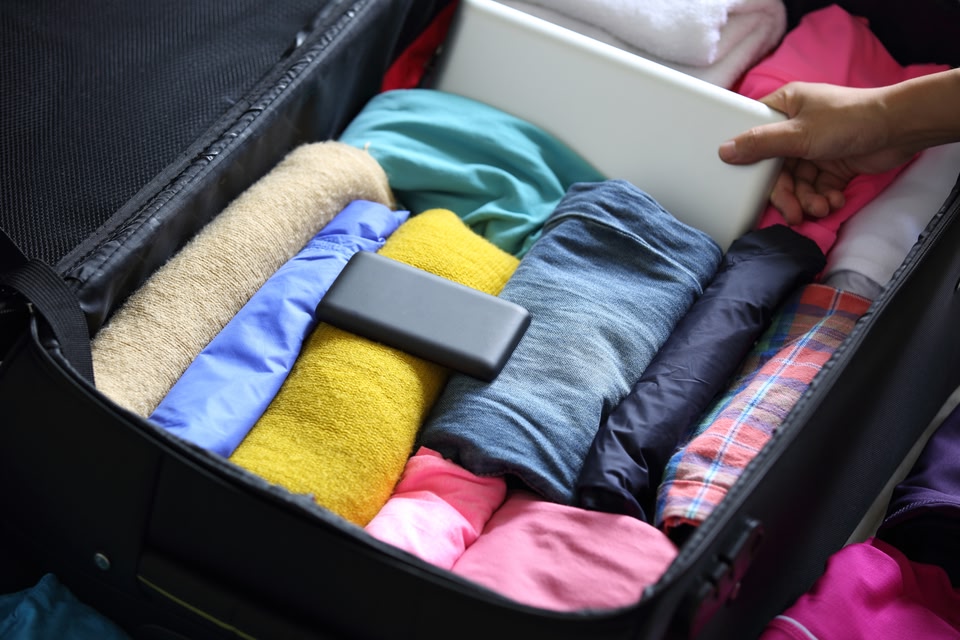 Clothes rolled in a suitcase