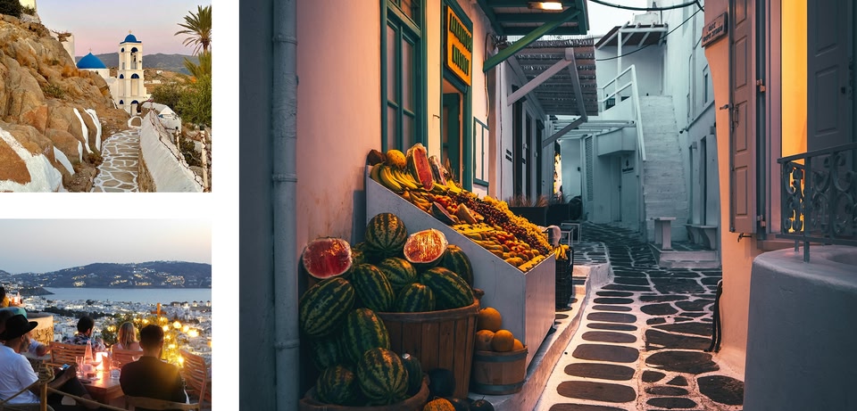 Scena di strada a Mykonos: edifici imbiancati a calce, bancarella di frutta e sentiero acciottolato.