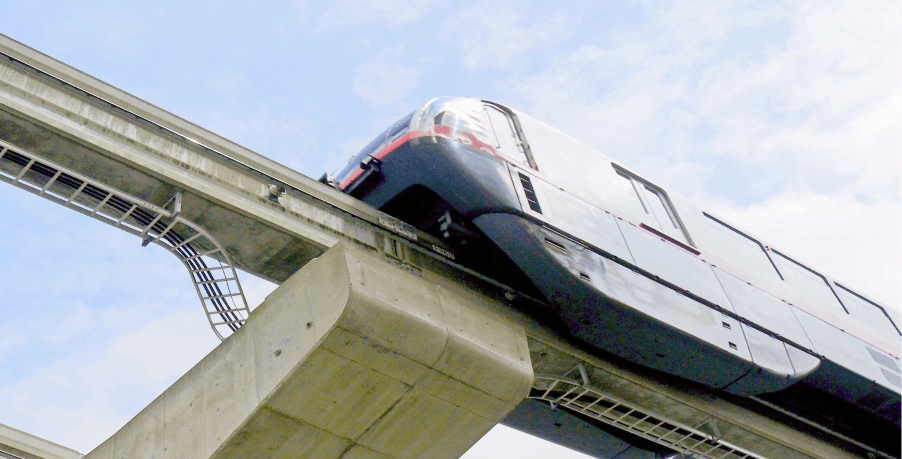 A picture looking up at Tokyo monorail. 