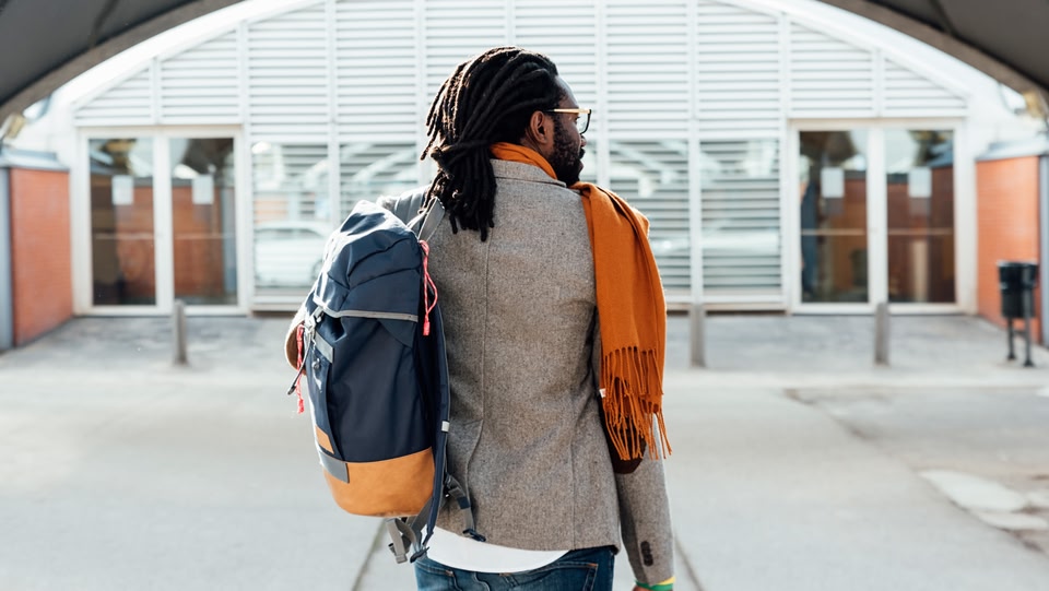 A man walking into an airport