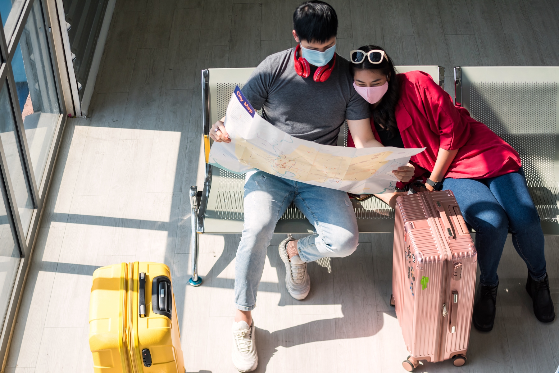 Two travelers looking at the map