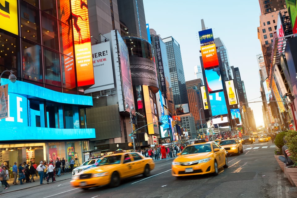 Yellow taxis racing through Time Square, New York