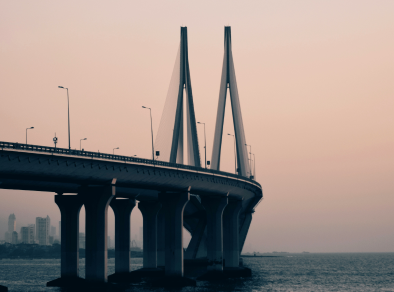 Scenic view of the iconic Bandra Worli sea link bridge against a backdrop of soft pink sky, creating a picturesque and serene atmosphere.