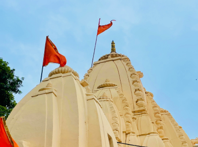 a building with red flags on top in Delhi