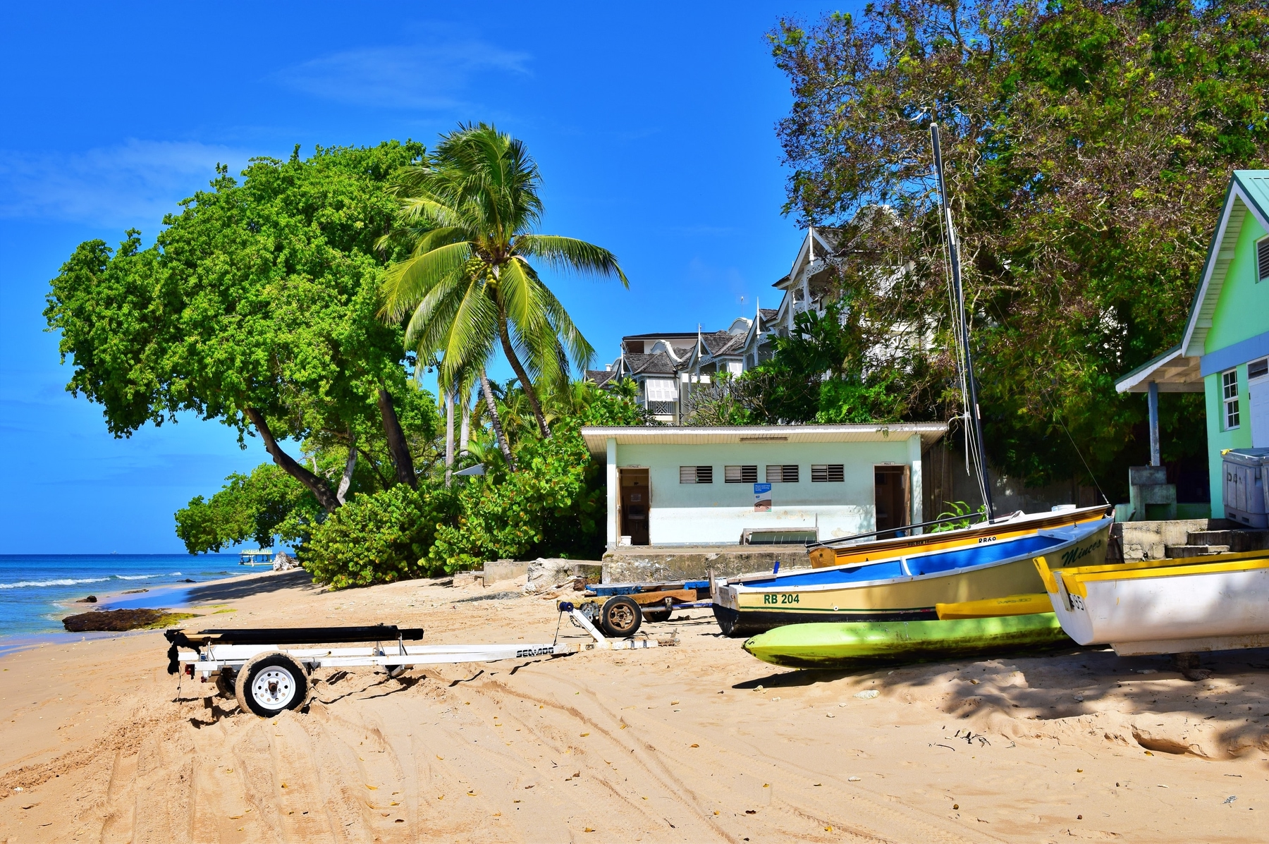 boats by the beach in Barbados, a great Caribbean destination in May