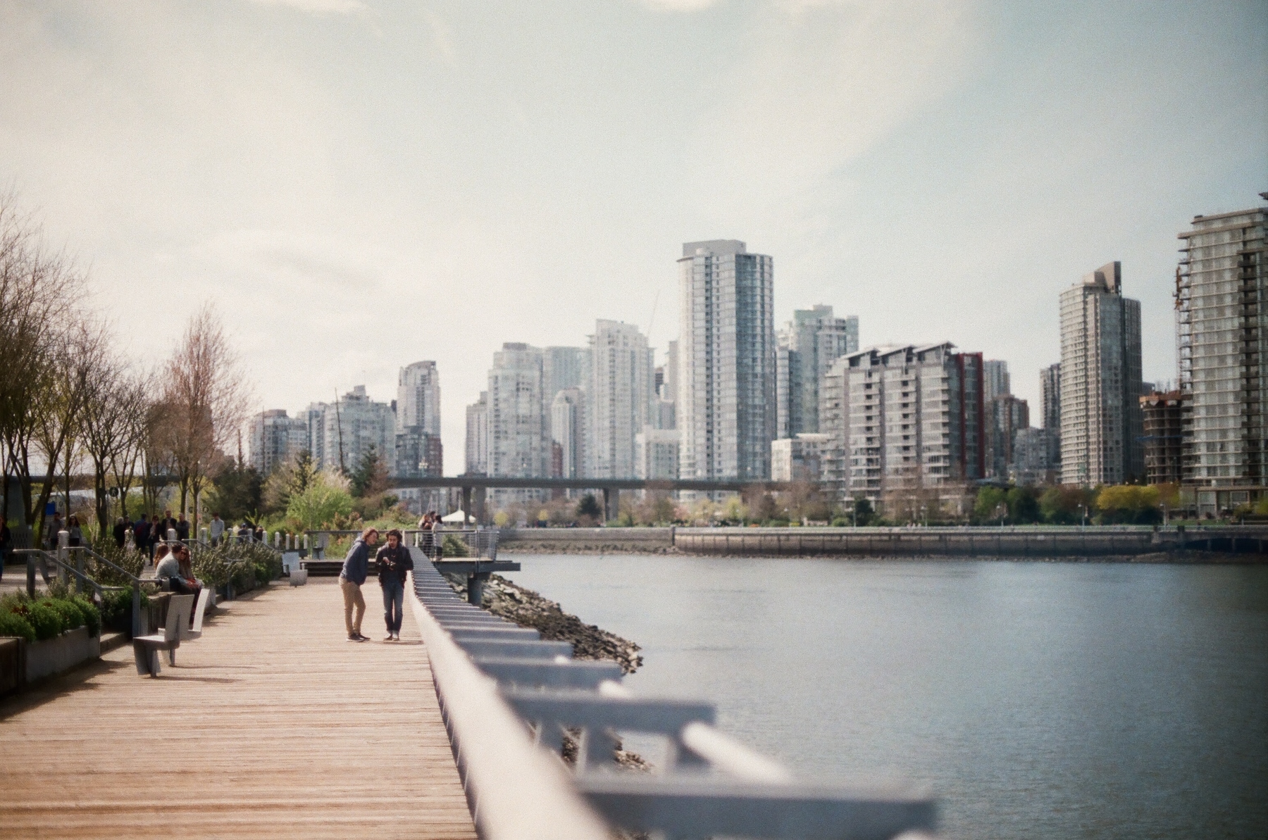 people walking along the seawall in Vancouver, BC