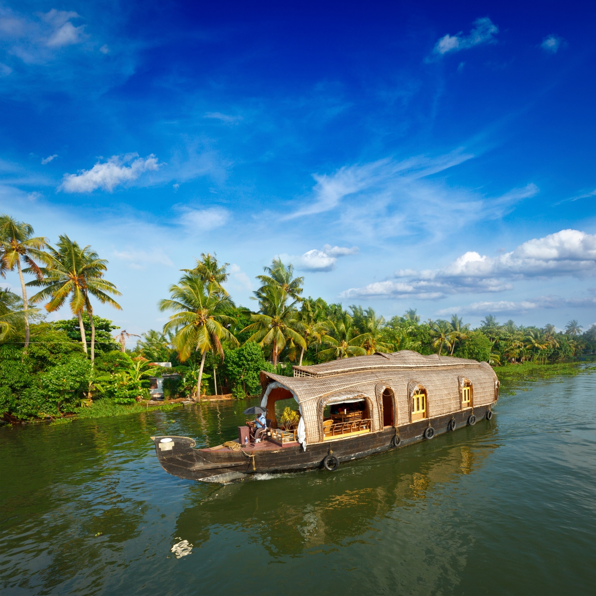 Cruising the backwaters on a house boat - 10 cheap holiday destinations around the world