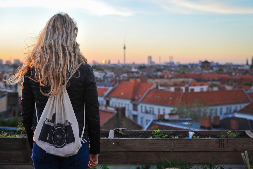 Woman with a backpack checking the view in Berlin