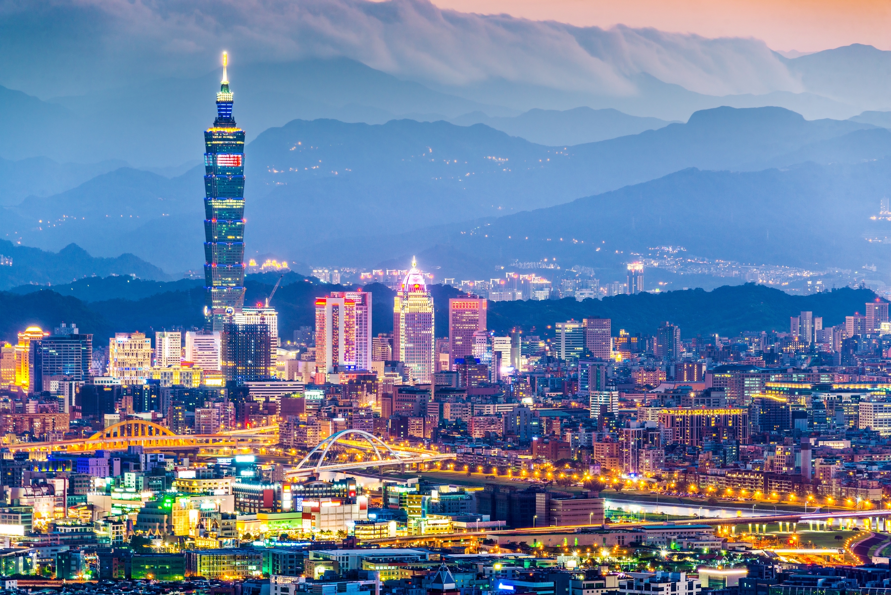 view of Taipei and Taipei 101 with mountains in the distance