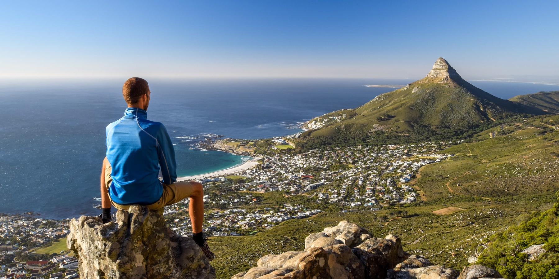 Person on a mountain looking at Cape Town