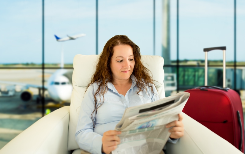 Passenger reading newspaper