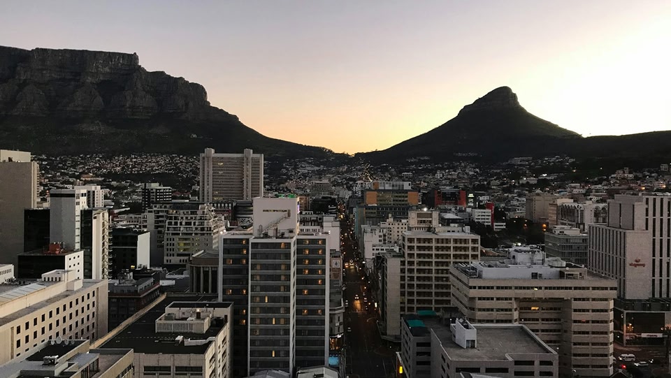 Aerial view of Cape Town, South Africa, with Table Mountain and Lion's Head in the background.