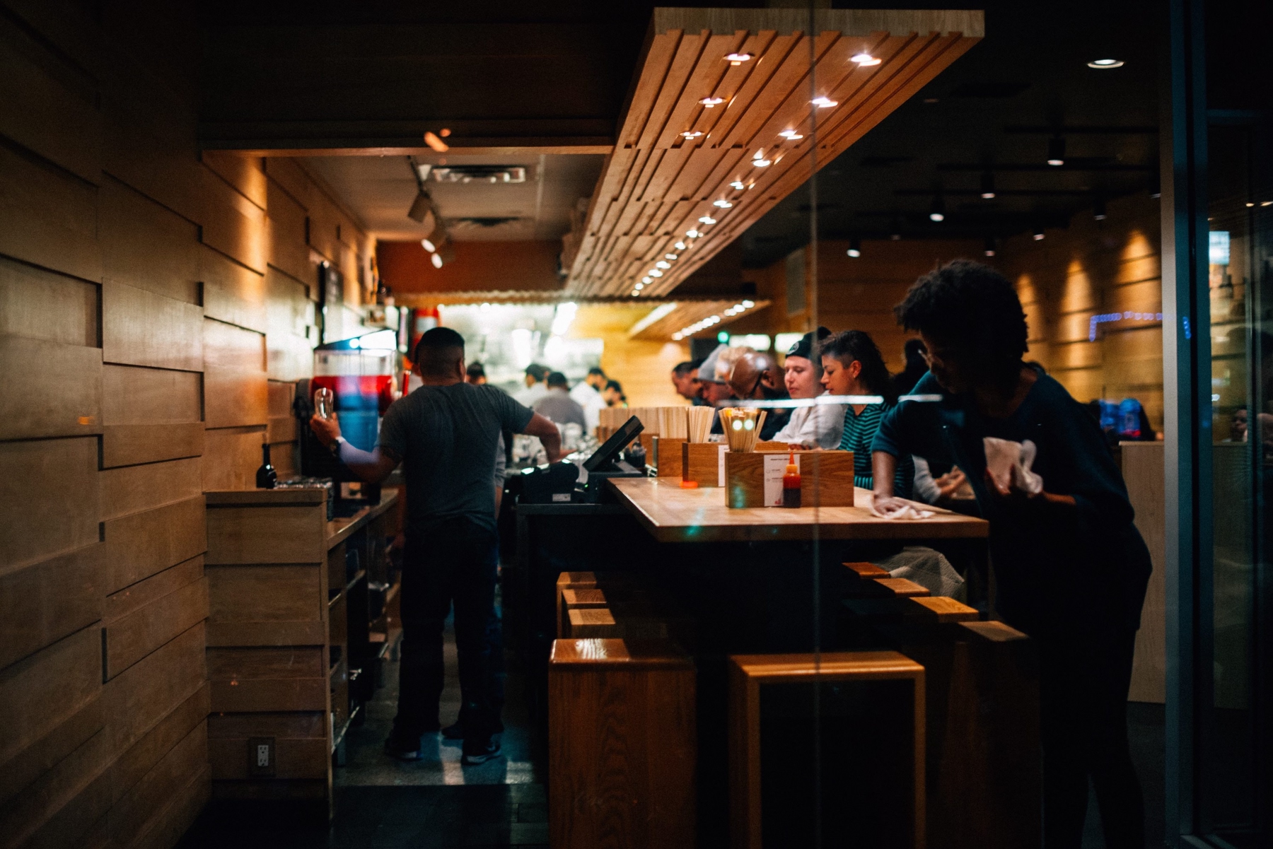 window view of momofuku restaurant in new york city at night