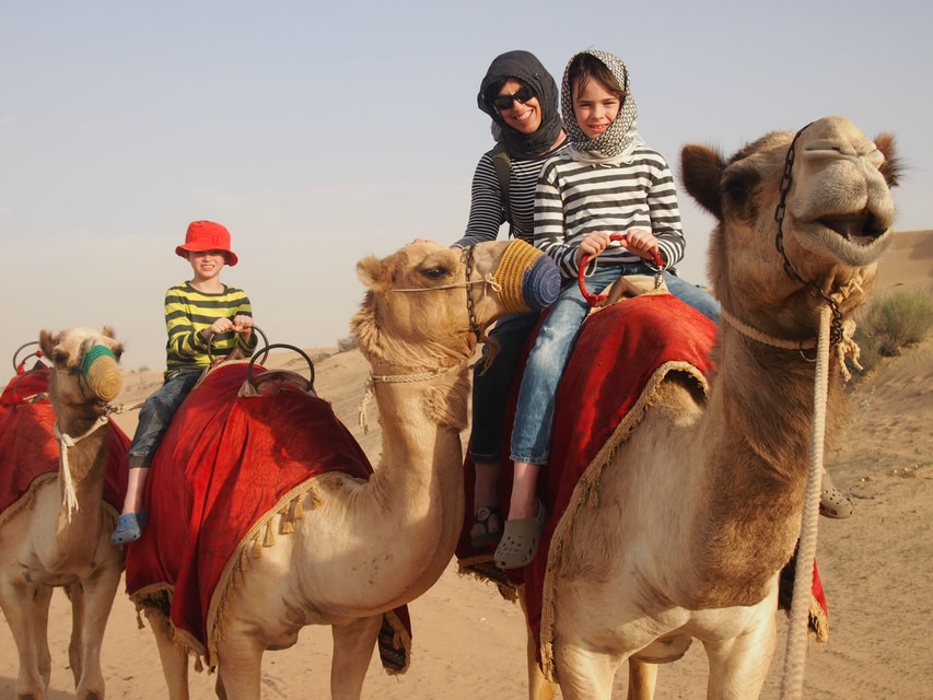 World Travel Family riding on camels