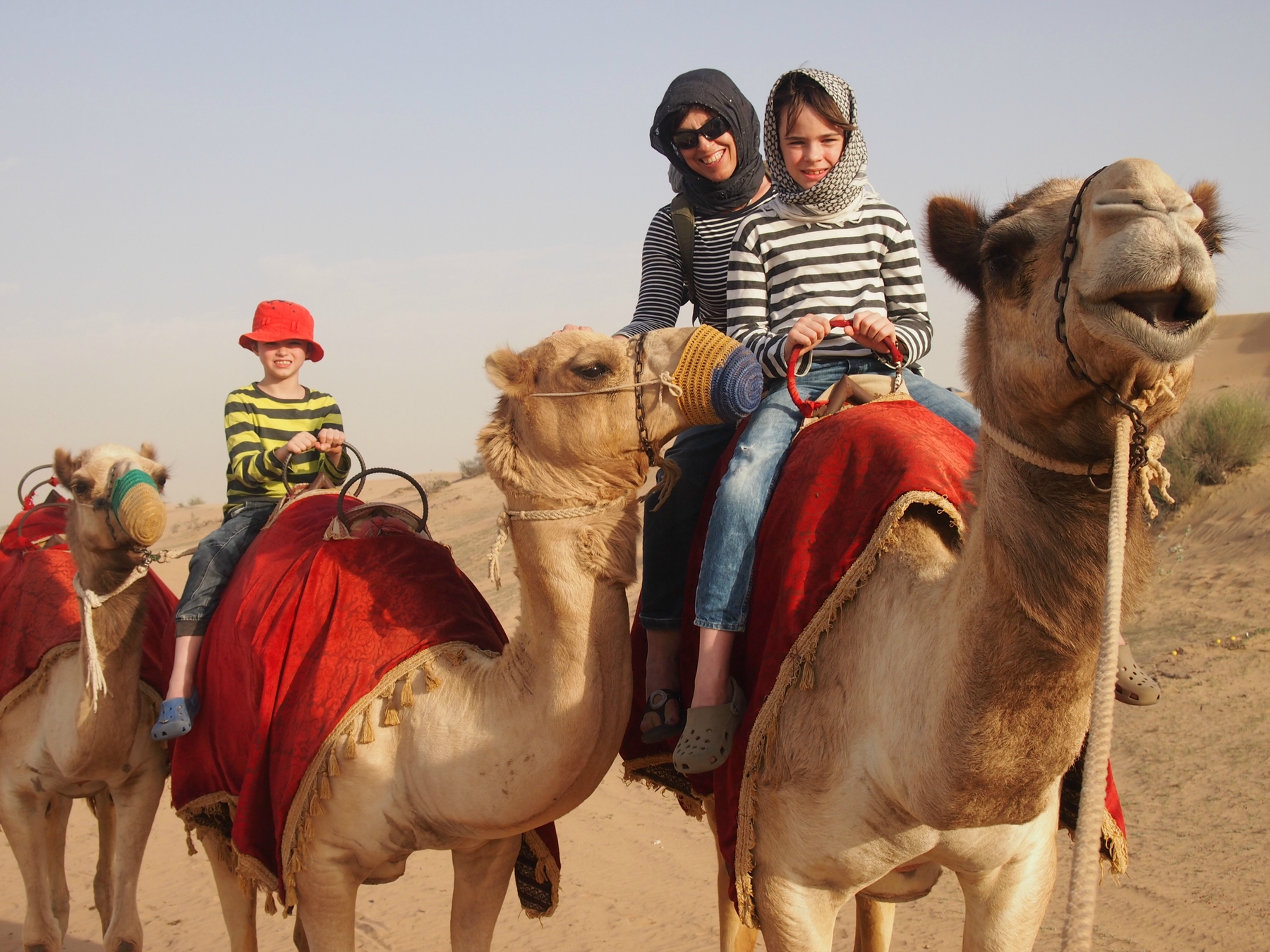 World Travel Family riding on camels