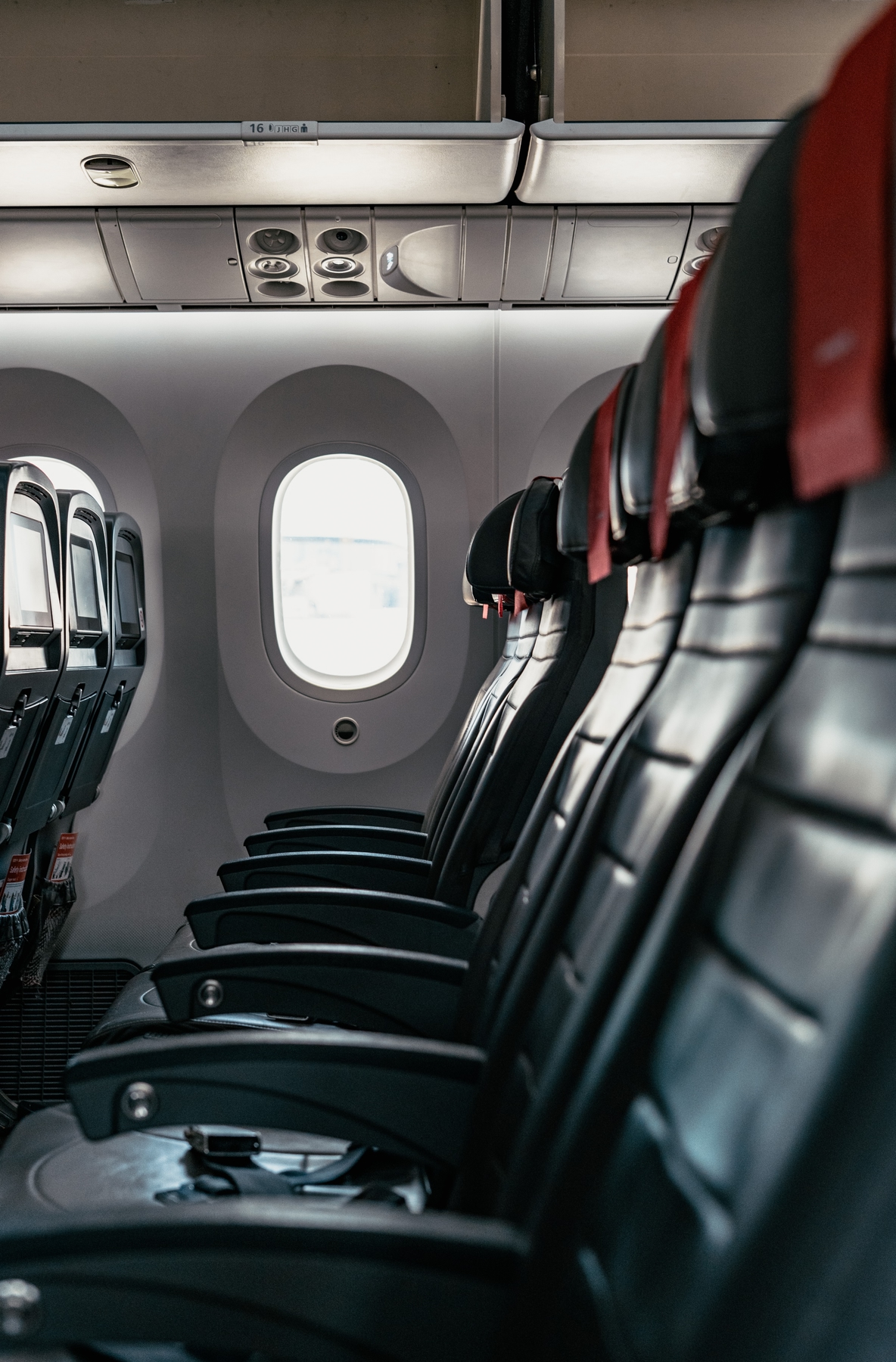 Row of empty seats in an airplane, flying during coronavirus outbreak