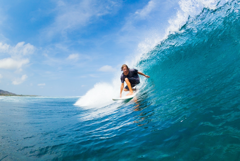A surfer surfing in the ocean.