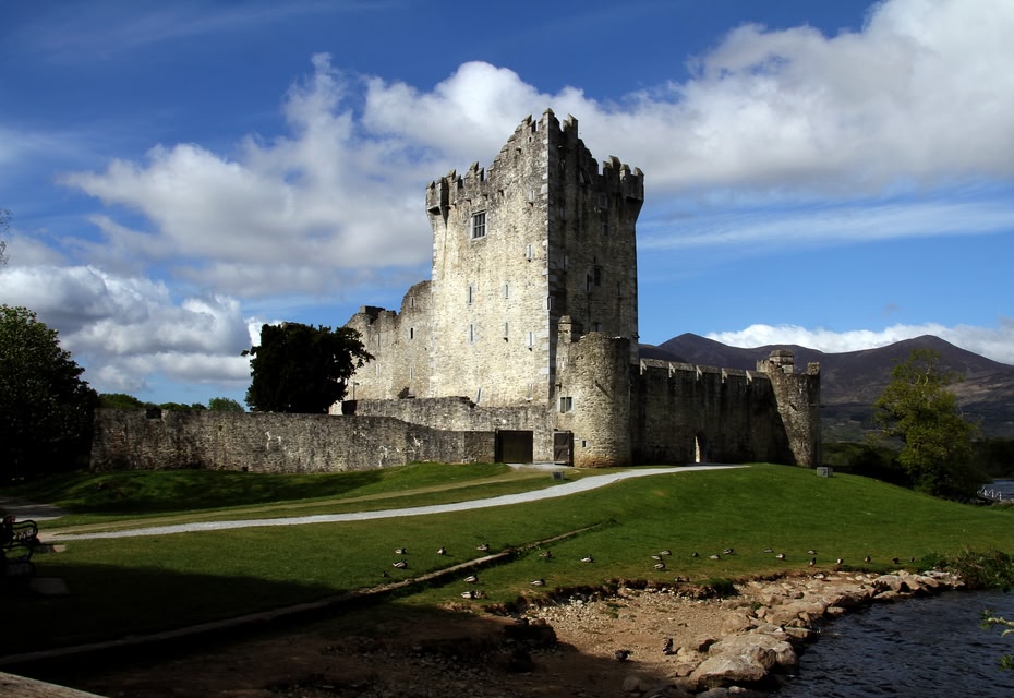 Woman holding two suitcases - City Breaks and Weekend Breaks Ireland