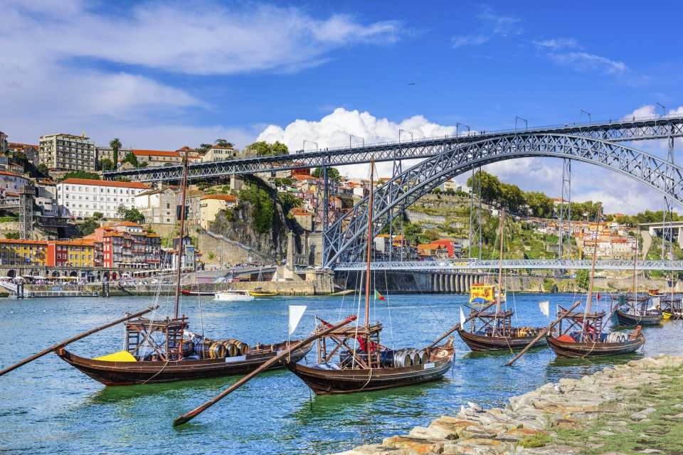 View of Porto from Vila Nova de Gaia
with Dom Luis I bridge in the background and old-fashioned boats in the foreground