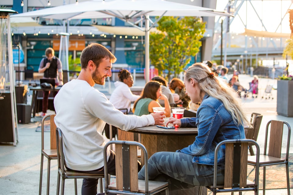 Couple enjoying an al-fresco drink in The Banks, Cincinnati.