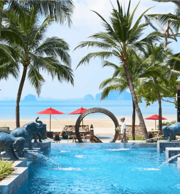 A stunning view of the pool, beach and bay outisede the Amari Vogue Krabi Resort