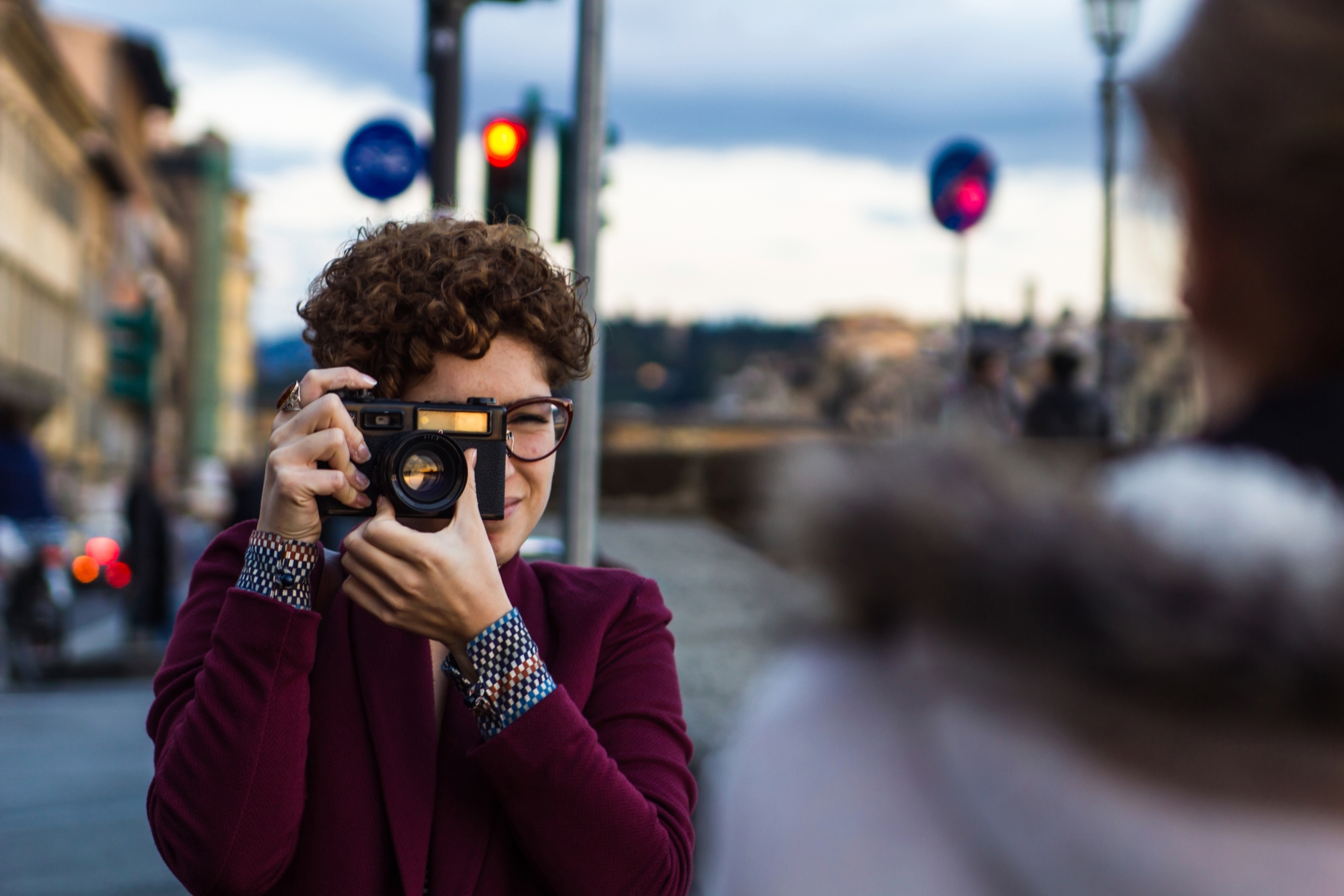 woman holding a camera taking a picture