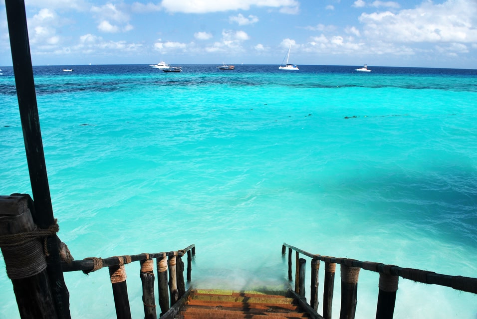 Jetty descending into turquoise waters in Zanzibar