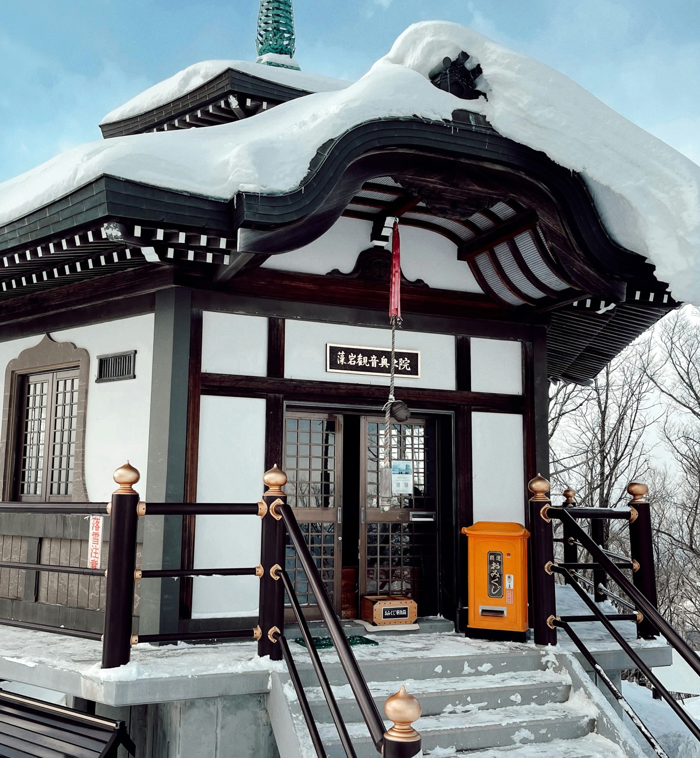 Snow topped traditional black and white building in Sapporo Japan