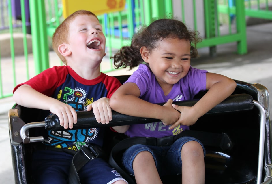 Two children enjoying the rides at Kings Island