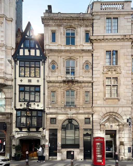 building in London and red phone booth.