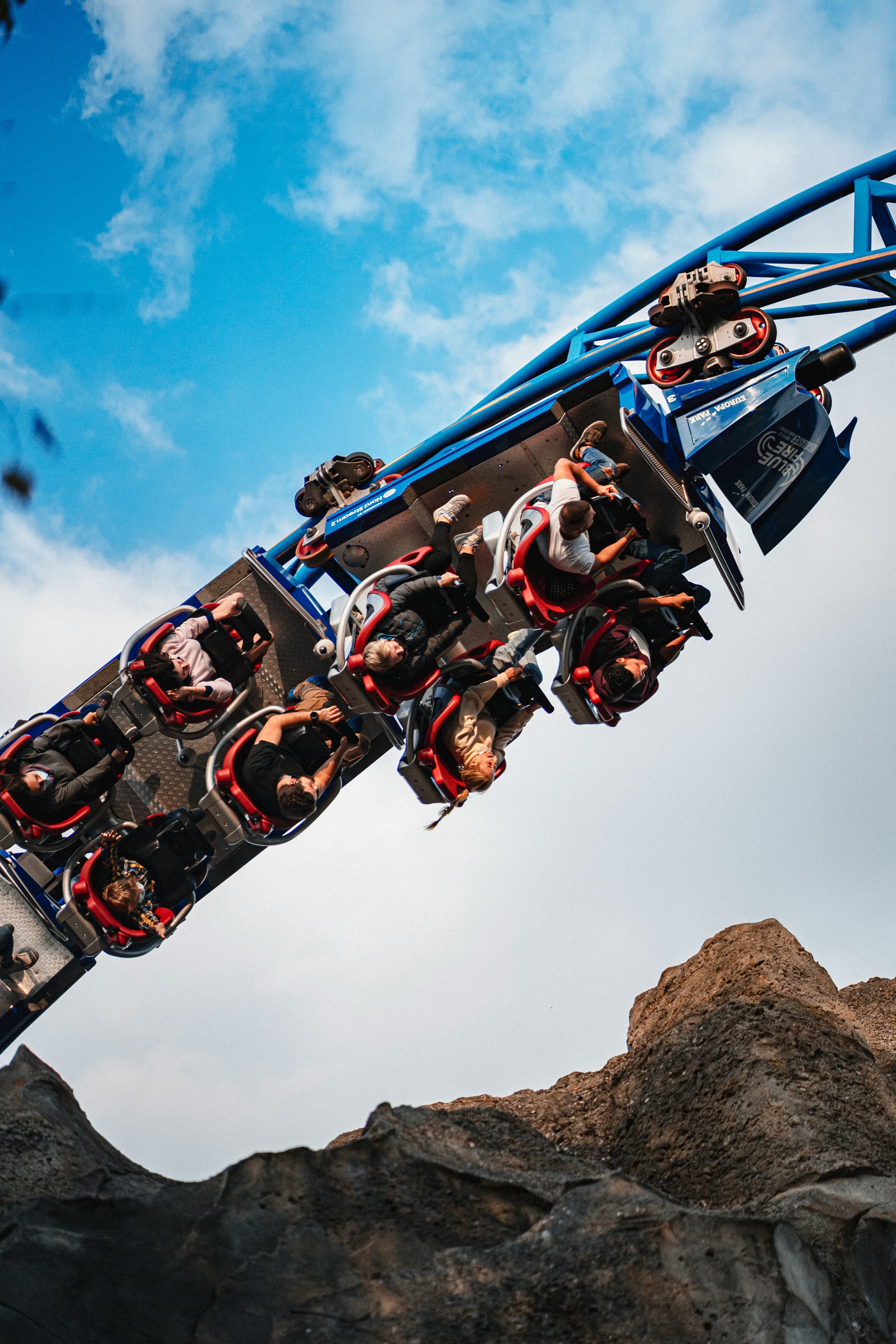 People on the Blue Fire rollercoaster going upside down at Europa Park theme park