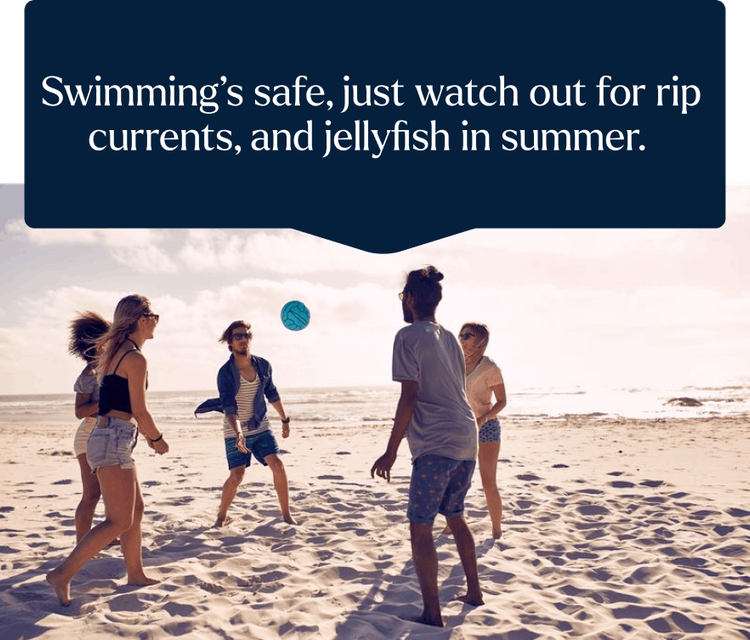 People on a beach playing volleyball. The picture is accompanied by a caption which