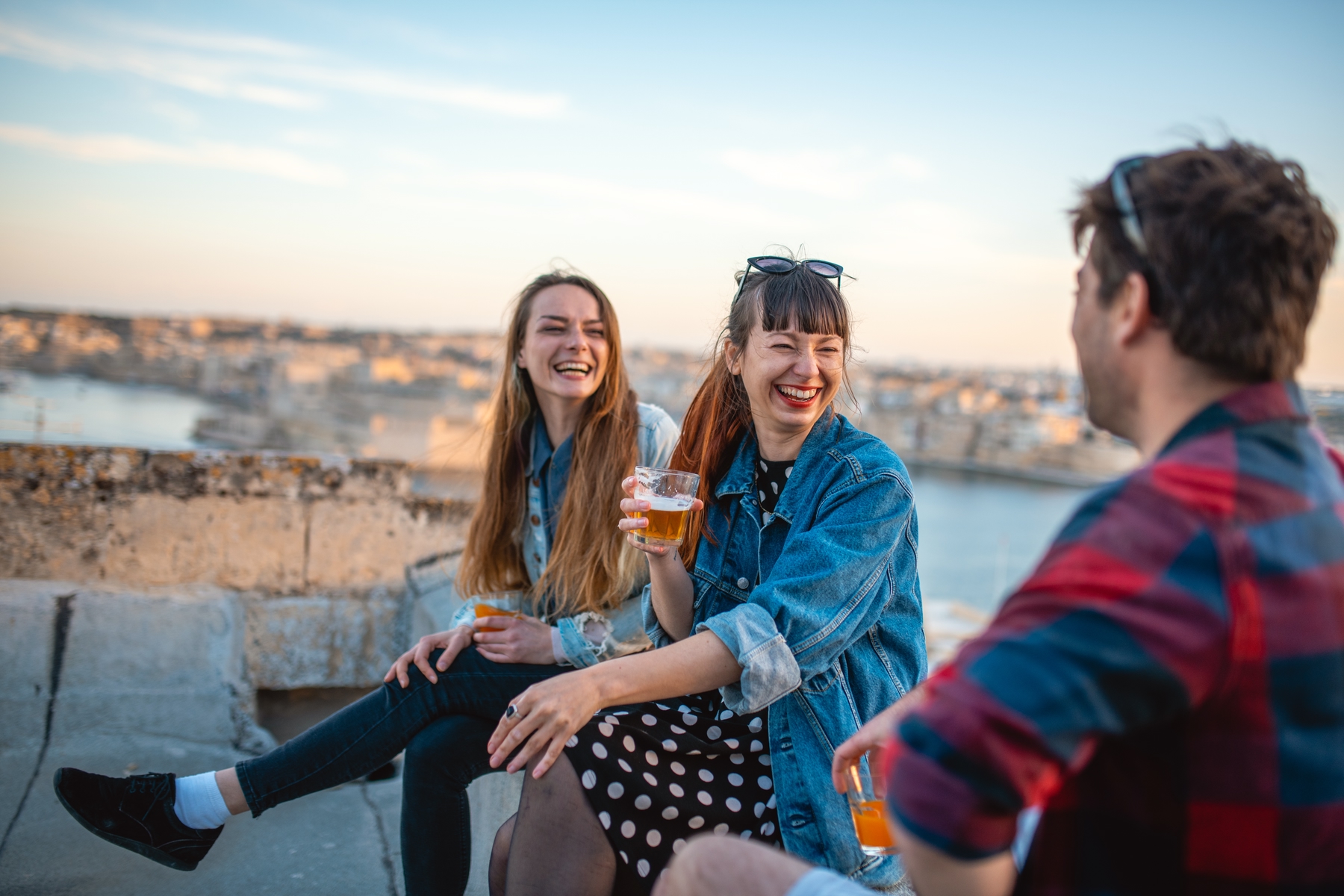Solo traveller making friends on a rooftop