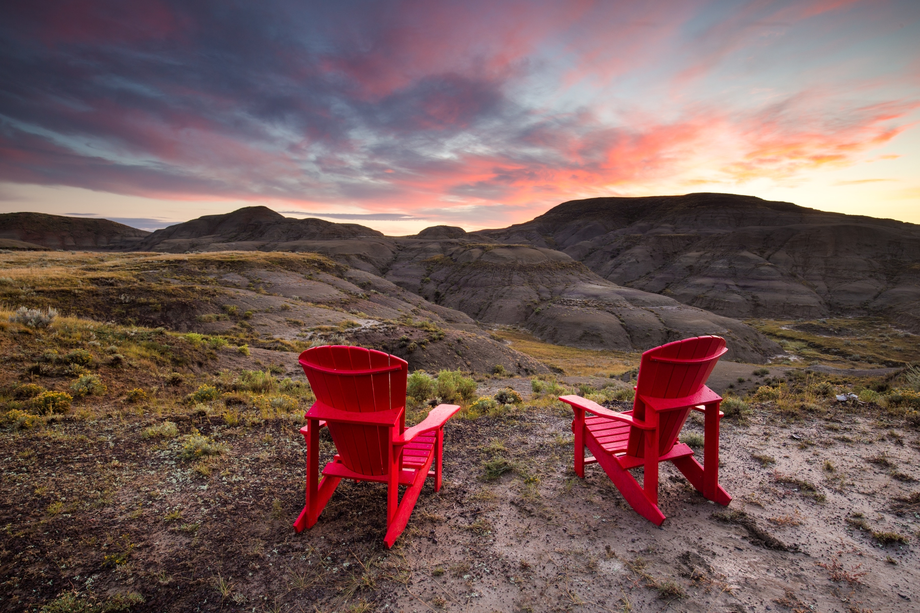 red muskoka chairs at Grasslands National Park in Saskatchewan