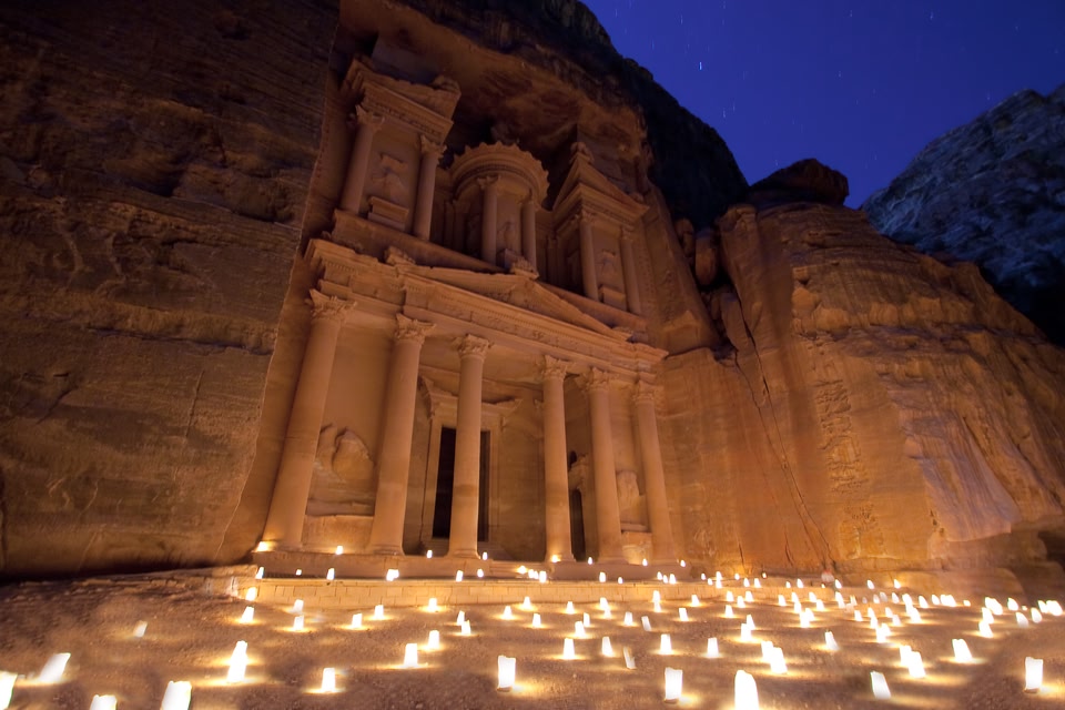 Petra treasury illuminated by candles