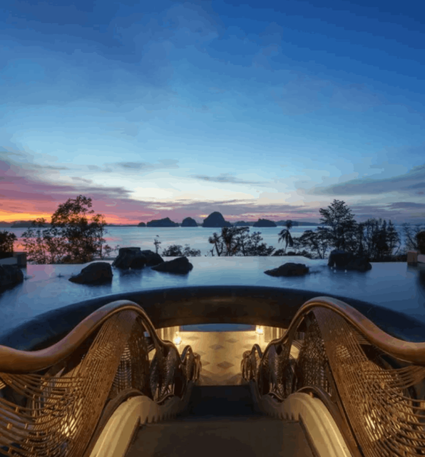The entrance and pool of the Banyan Tree Krabi Resort - The view looks out onto the bay at sunset